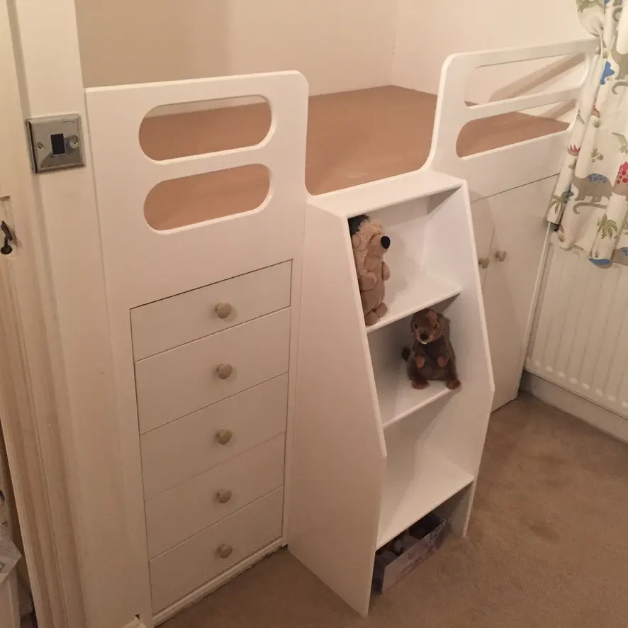 White painted cabin bed frame fitted into the alcove, drawer runners masked