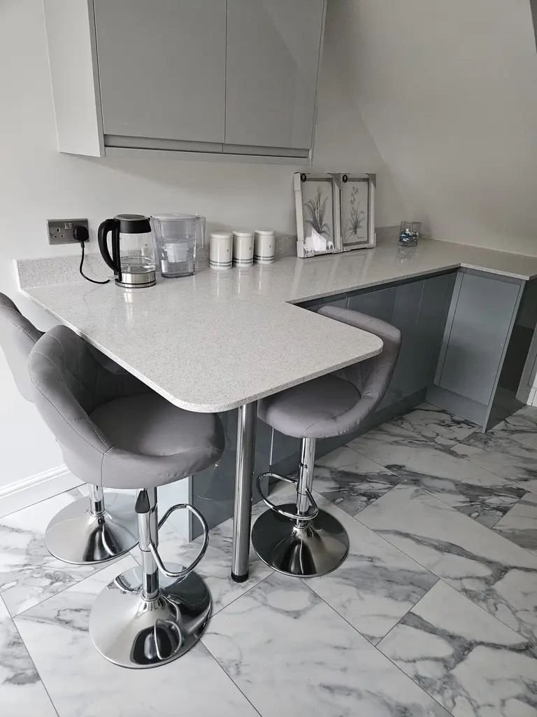 Curved breakfast bar on a chrome leg, Stevenage