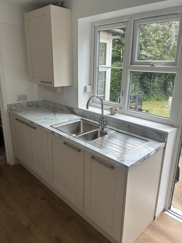 Cream shaker sink run with marble-effect worktop, Welwyn Garden City