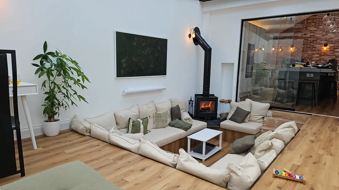 The sunken lounge finished, wood burner lit, Letchworth