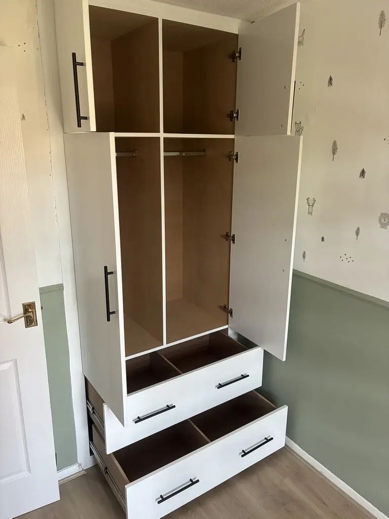 Armin's wardrobe open: hanging rails, cupboards and drawers, Welwyn Garden City